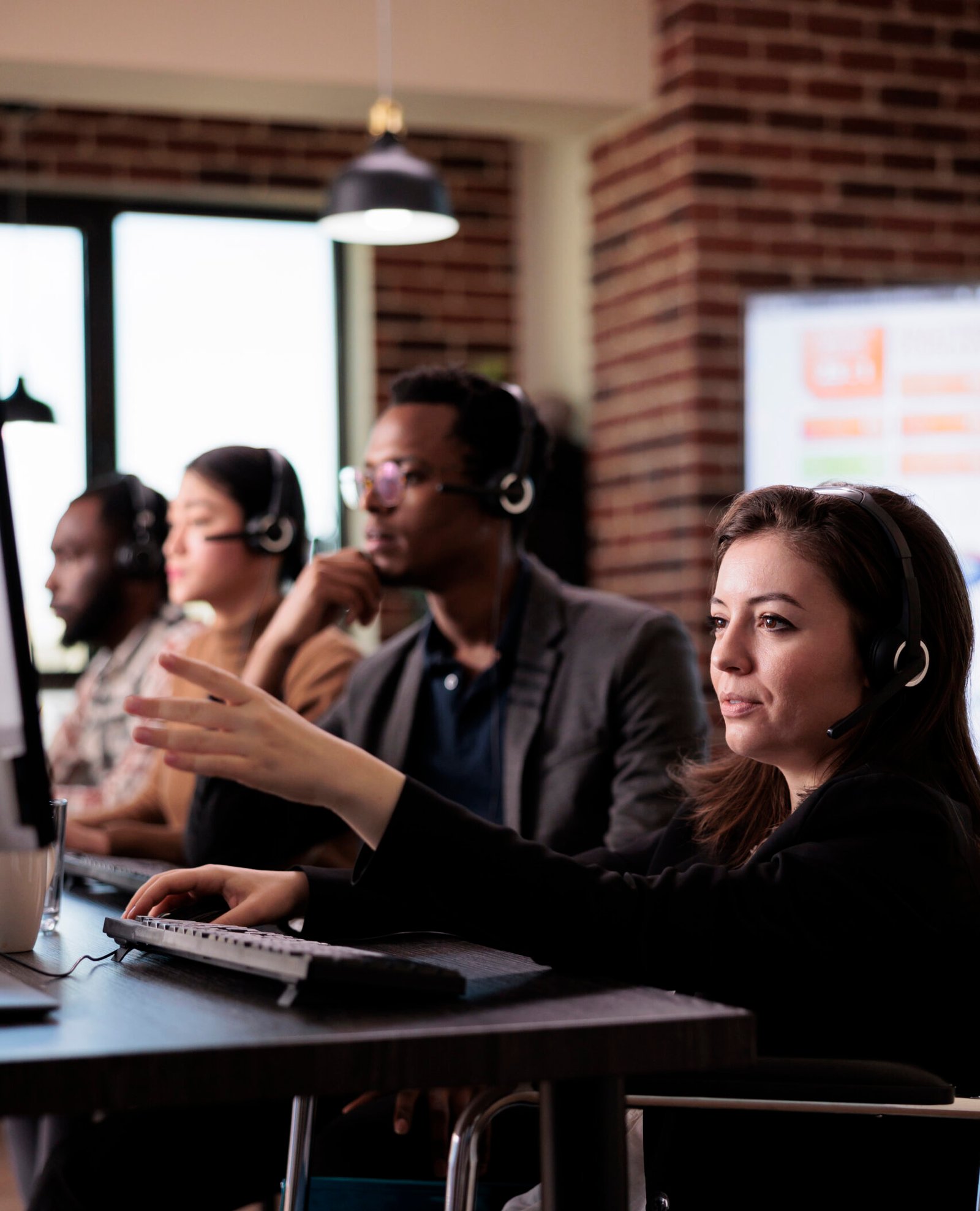 woman living with disability answering client call at customer service